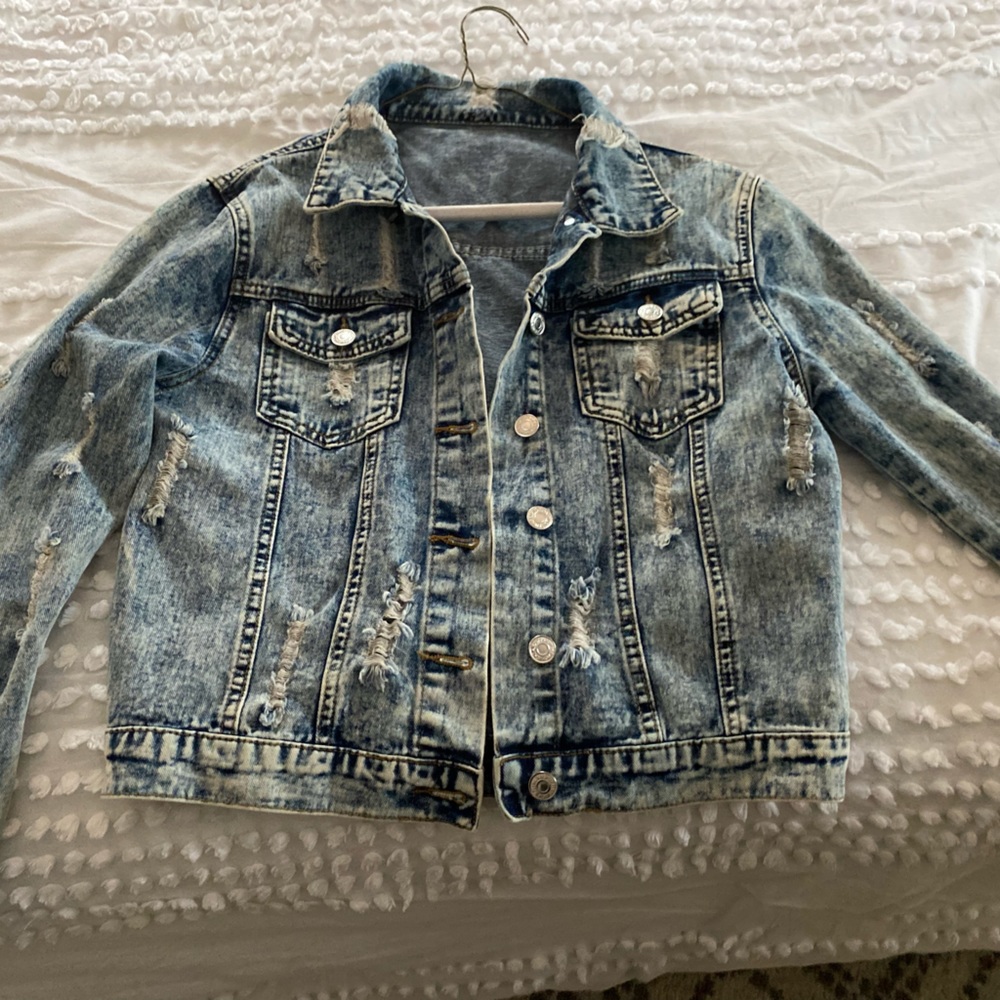 Distressed denim jacket, perfect with any outfit